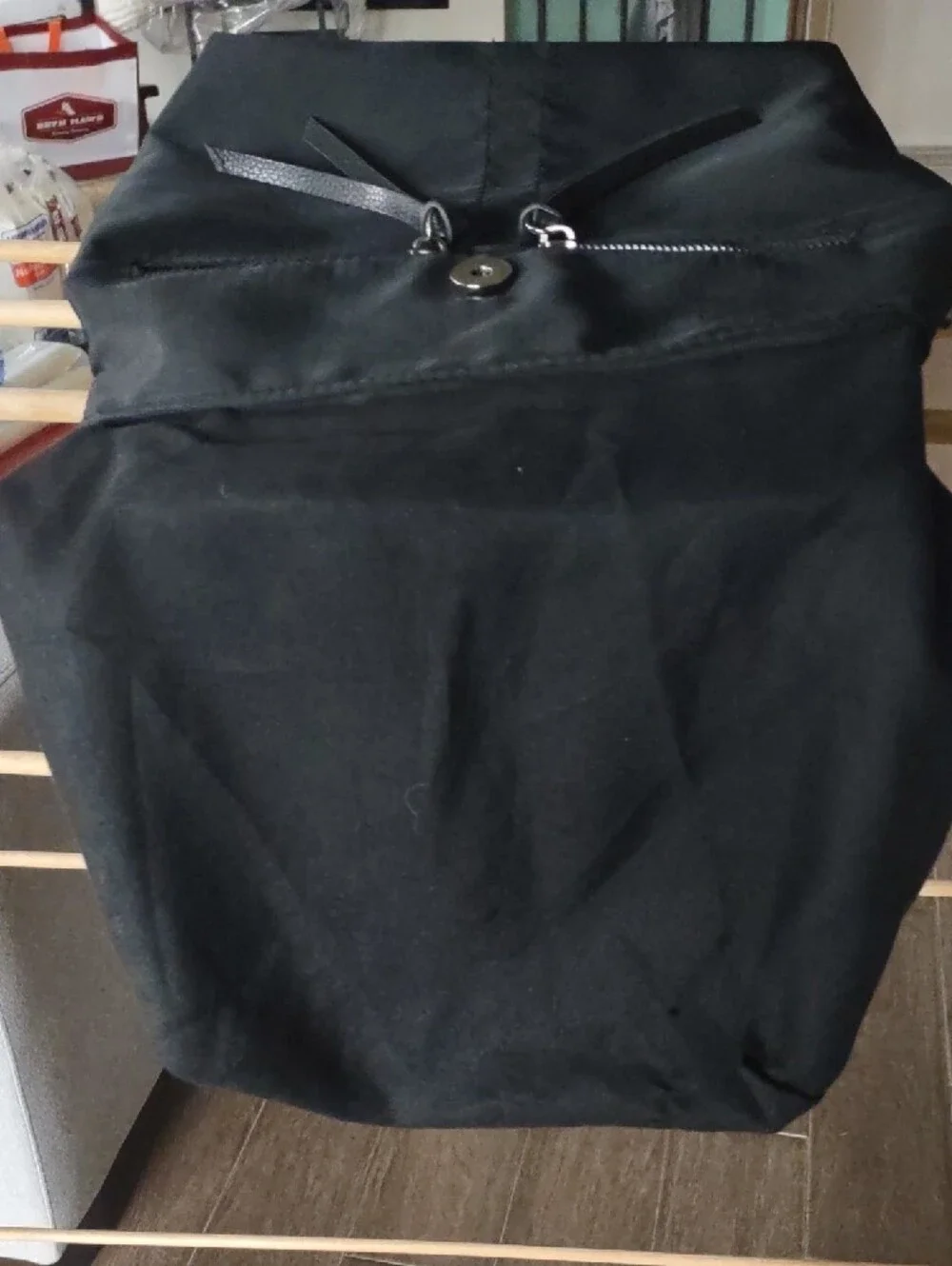Botkier Black Backpack with Textured Flap, Adjustable Straps And Zip Pockets